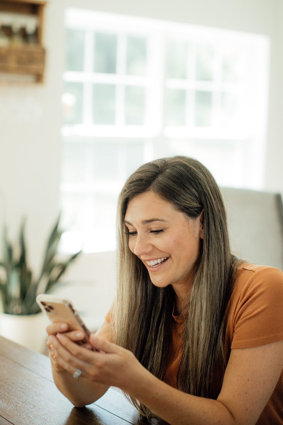 Happy Woman using Mobile Phone